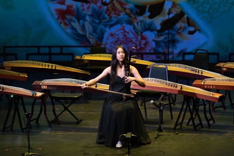 A YCMA student performing an erhu solo on stage